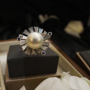 A beautiful white and blue zircon blooming flower shape silver ring with light white fresh water pearl